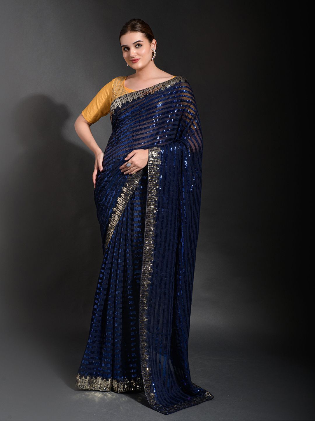 

Krimmple Striped Sequinned Pure Georgette Saree, Blue