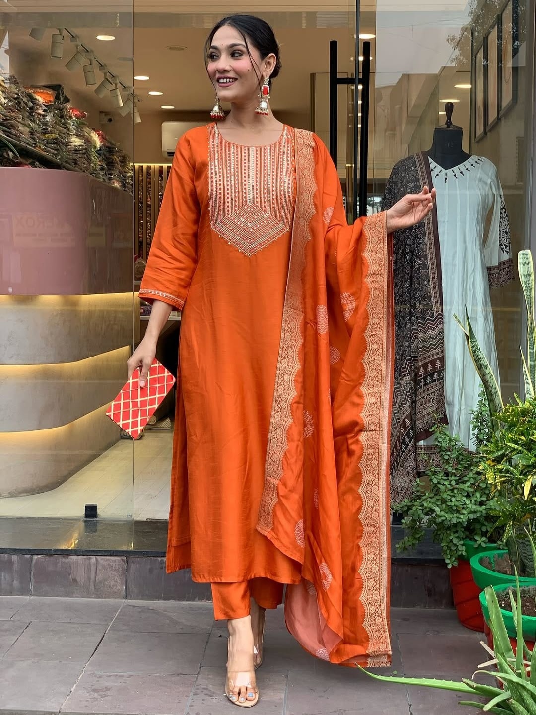 

KALINI Floral Yoke Design Thread Work Straight Kurta With Trousers And Dupatta, Orange