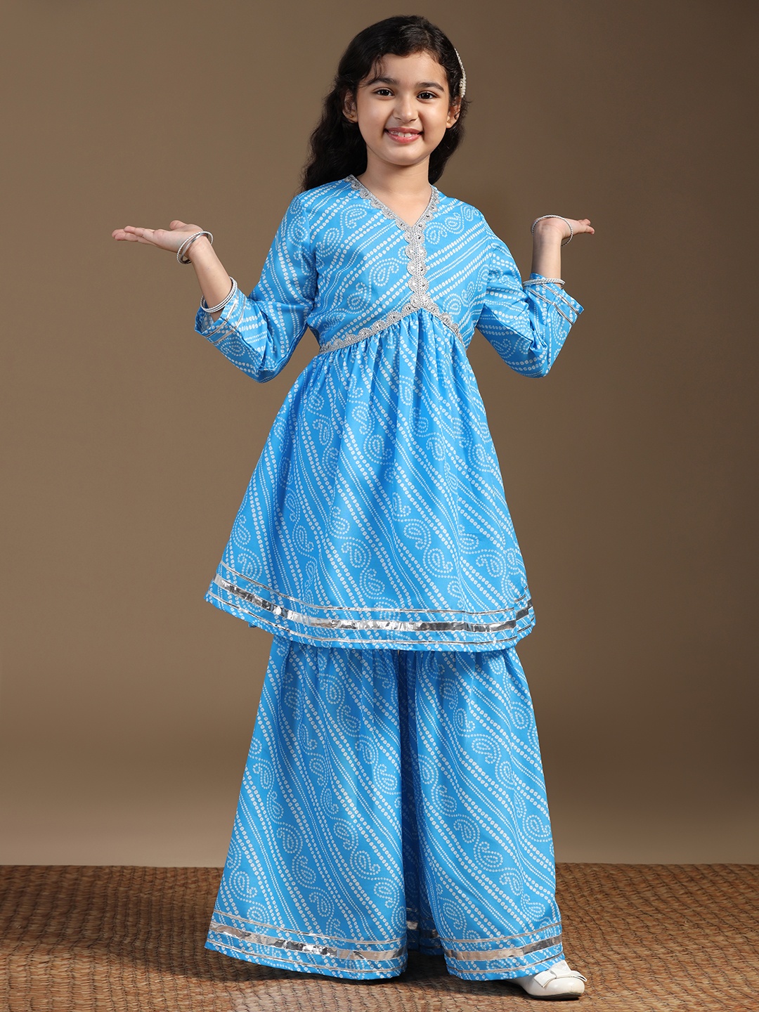 

Sangria Girls Blue Bandhani Printed V-Neck Empire Kurta With Palazzos