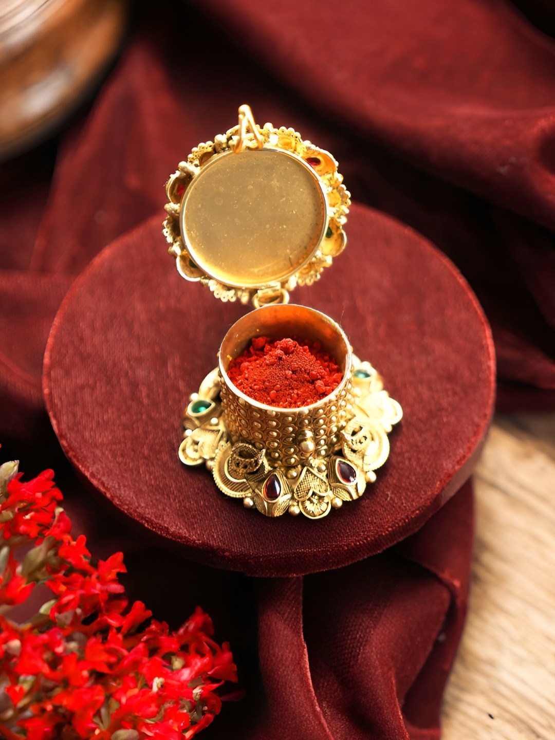 

Saraf RS Jewellery Gold-Toned & Red Textured Ganesha Design Kumkum Box