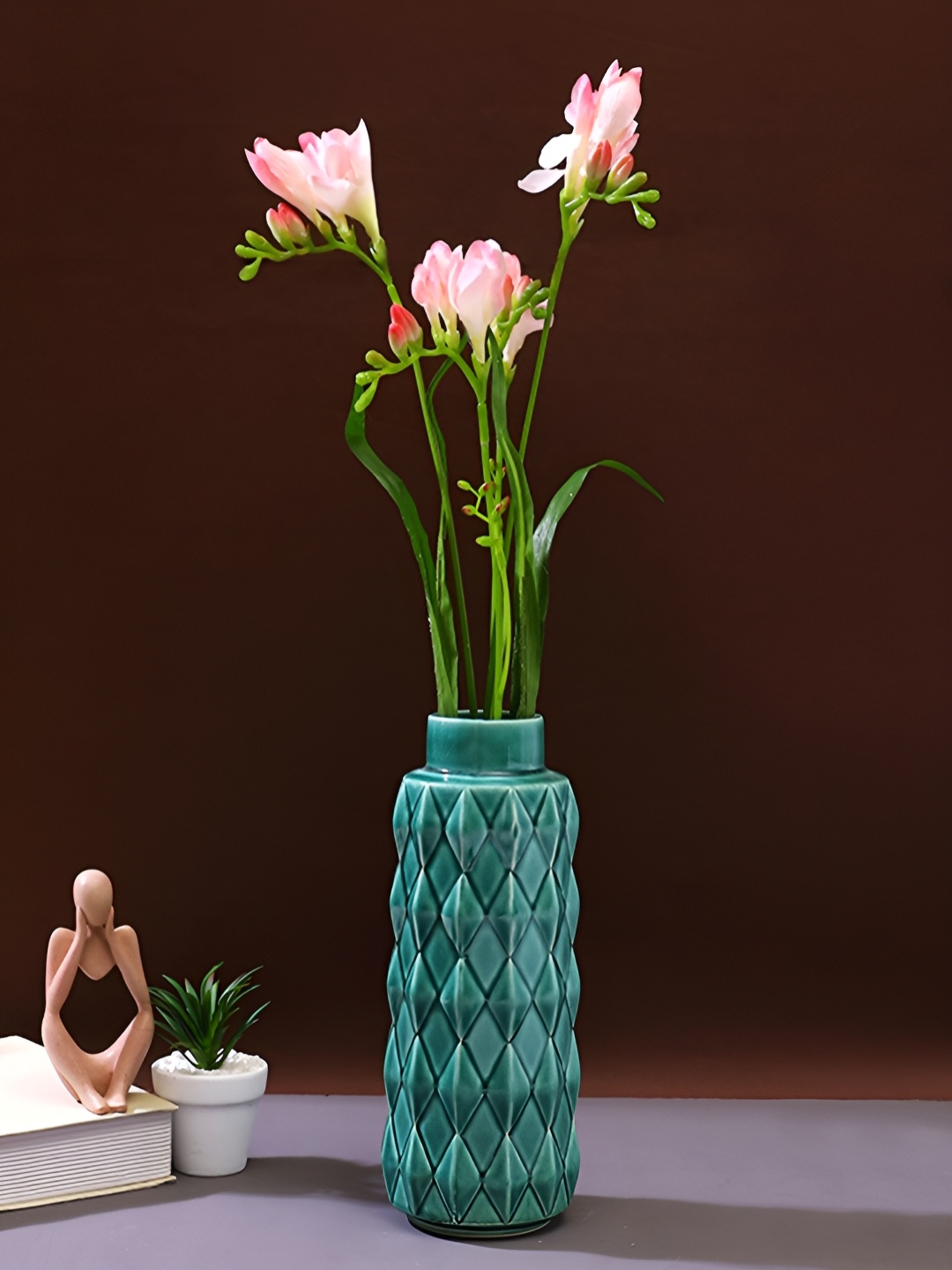 

Myntra Elegant Homes Green Geometric Textured Ceramic Flower Vase