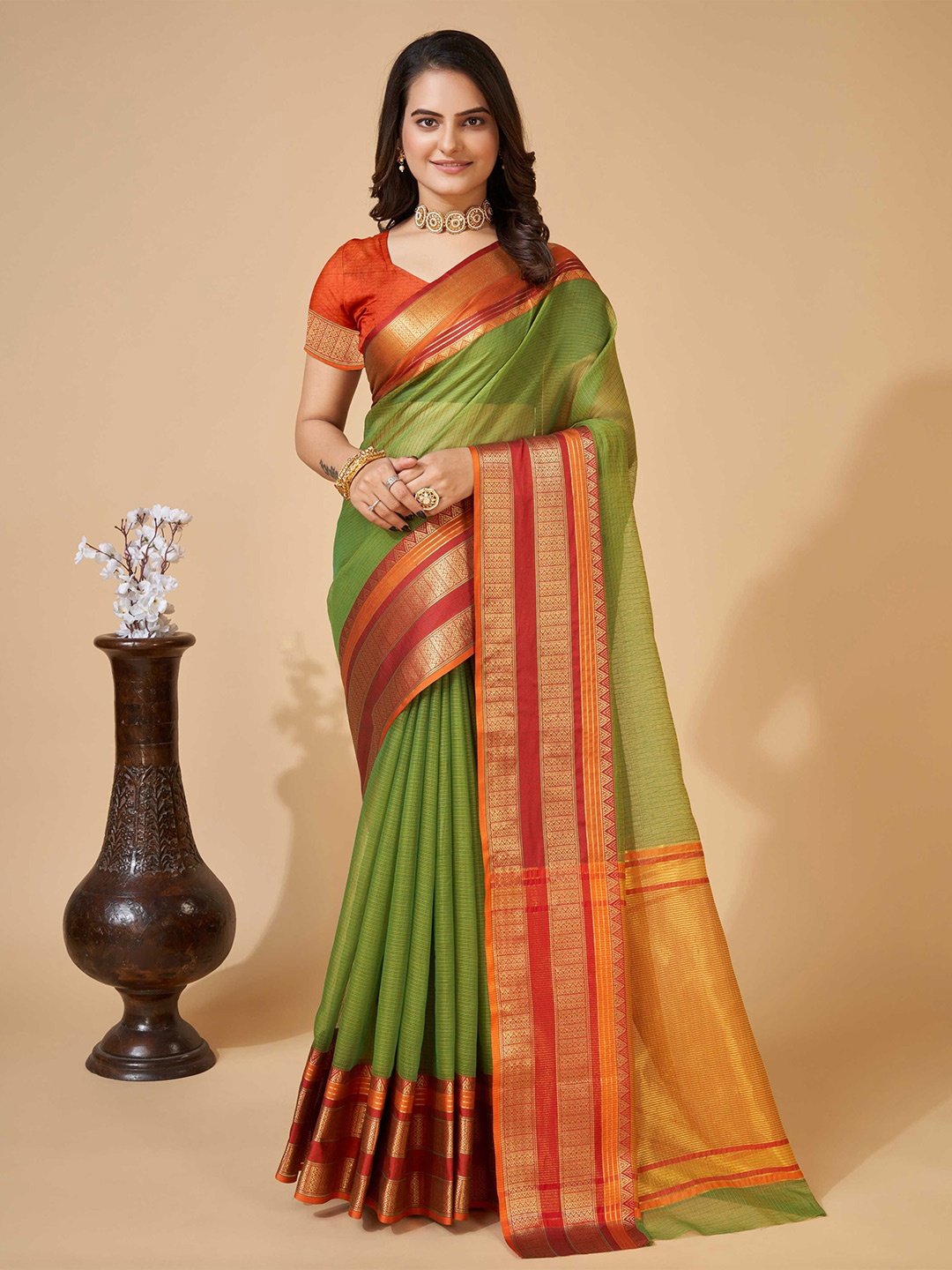 

DIVASTRI Woven Design Zari Silk Blend Saree, Green