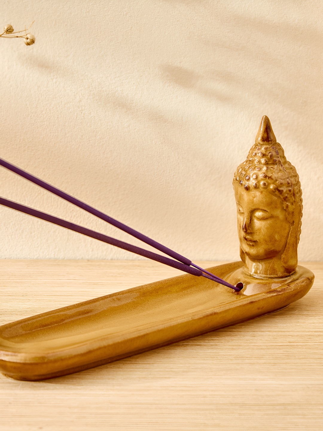 

Home Centre Yellow Glossy Garnet Serene Buddha Ceramic Incense Stick Holder
