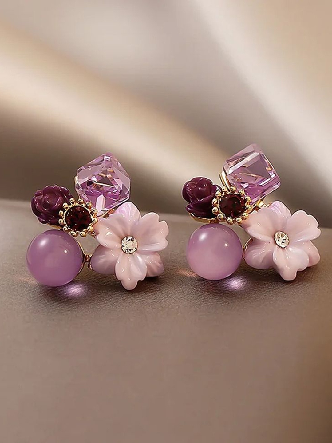 

Celestique Korean Artificial Stone Studded Floral Shaped Studs, Purple