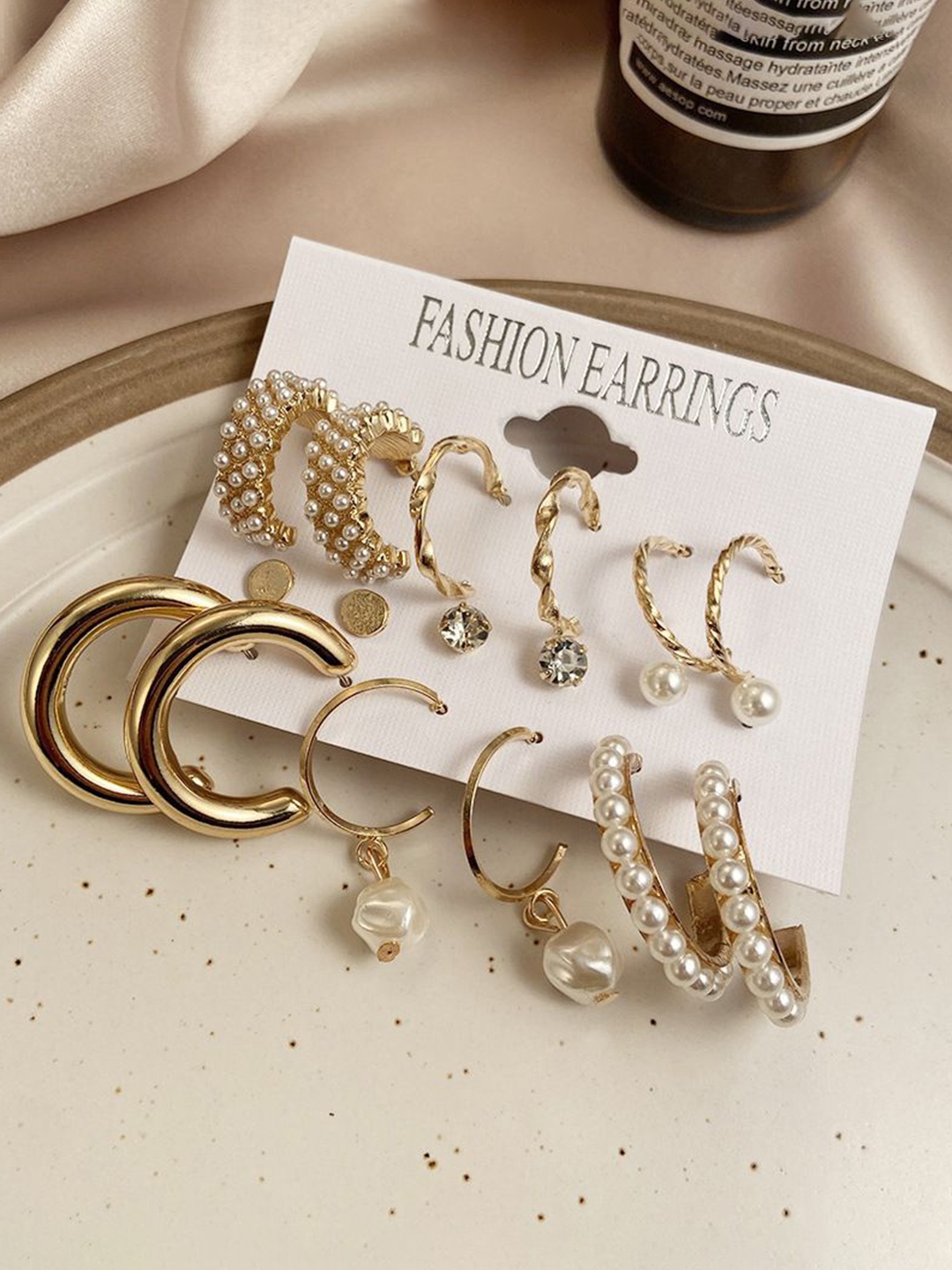 

Celestique Set Of 9 Gold Plated Contemporary Drop Earrings