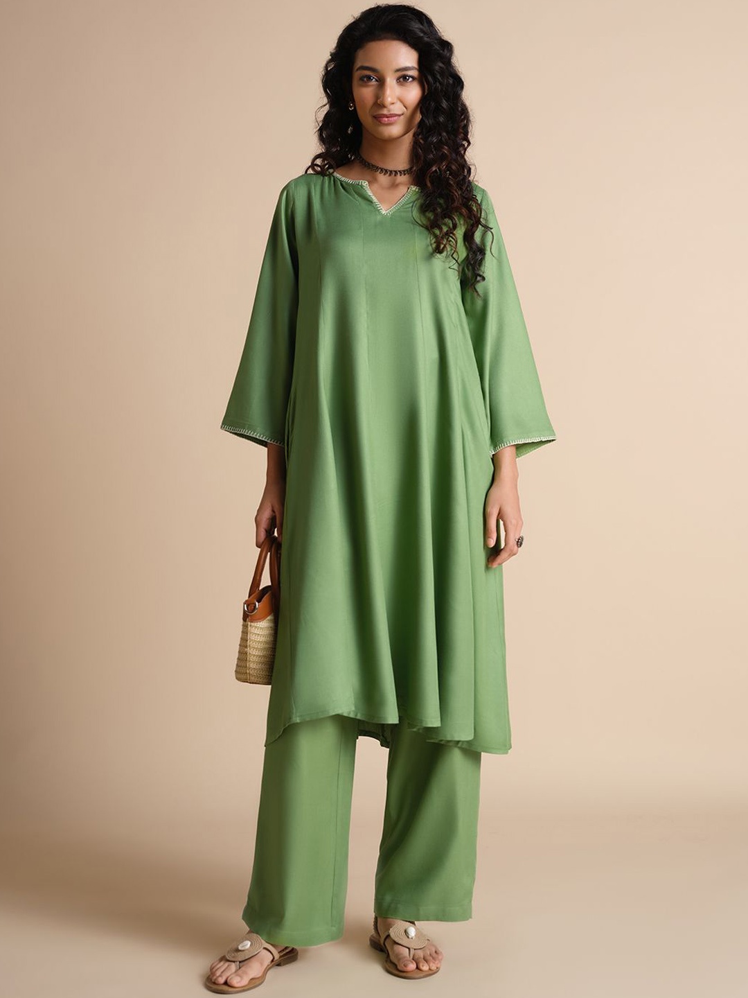 

Global Desi Notch Neck Flared Sleeves Thread Work A-Line Kurta, Green