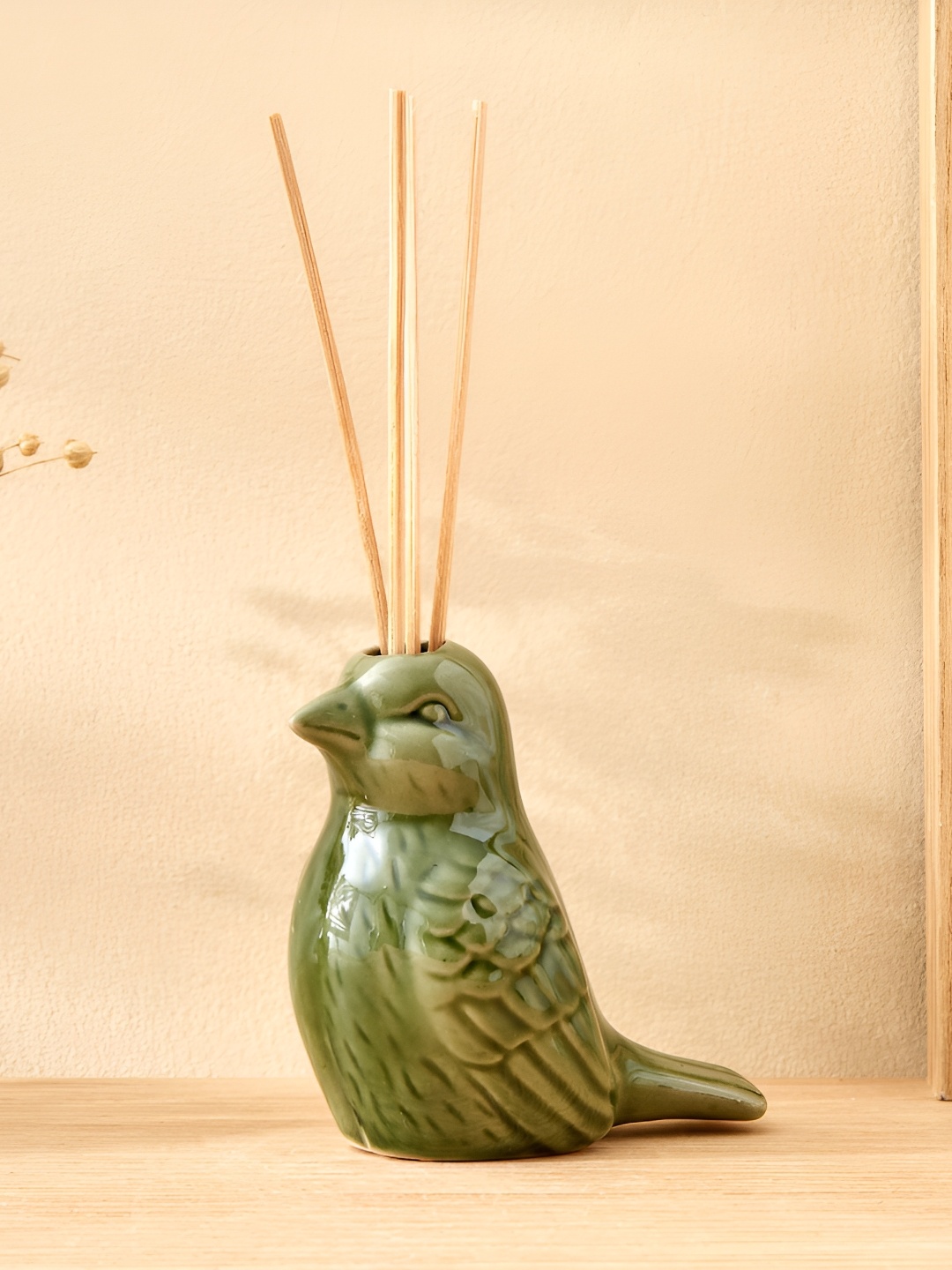 

Home Centre Green Glossy Divine Bird Reed Ceramic Diffuser Jar