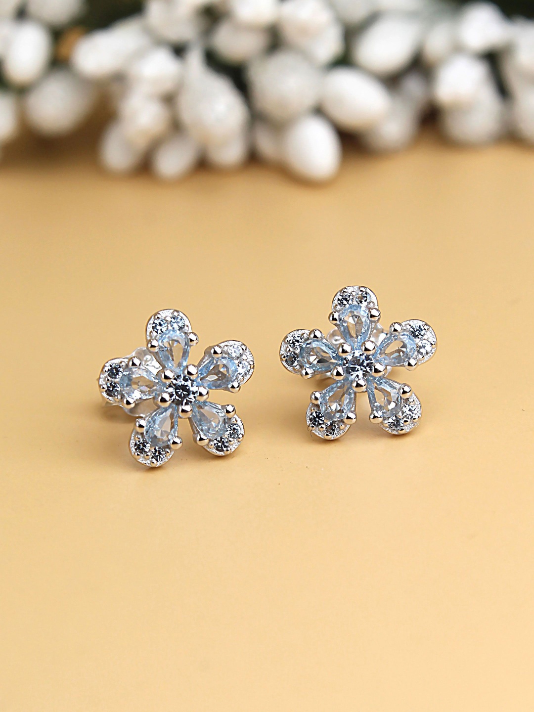 

DEVASHREE 925 Silver Rhodium-Plated Aquamarine CZ Studded Floral Shaped Studs