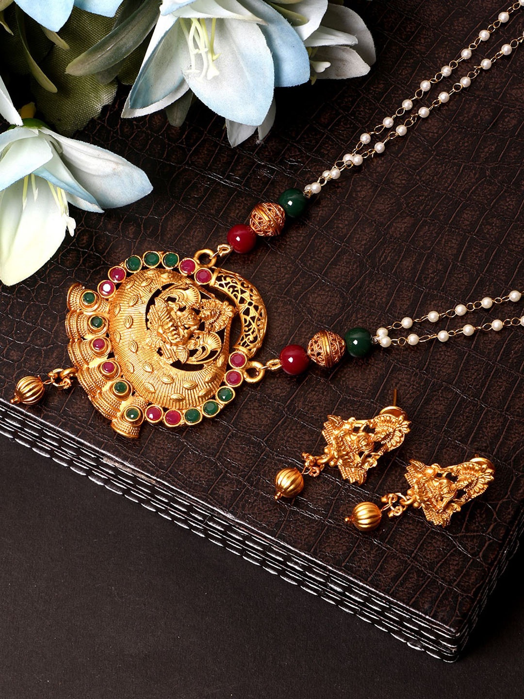 

Anouk Gold Plated And Red Stones Studded & Beaded Goddess Maa Laxmi Nacklace And Earrings