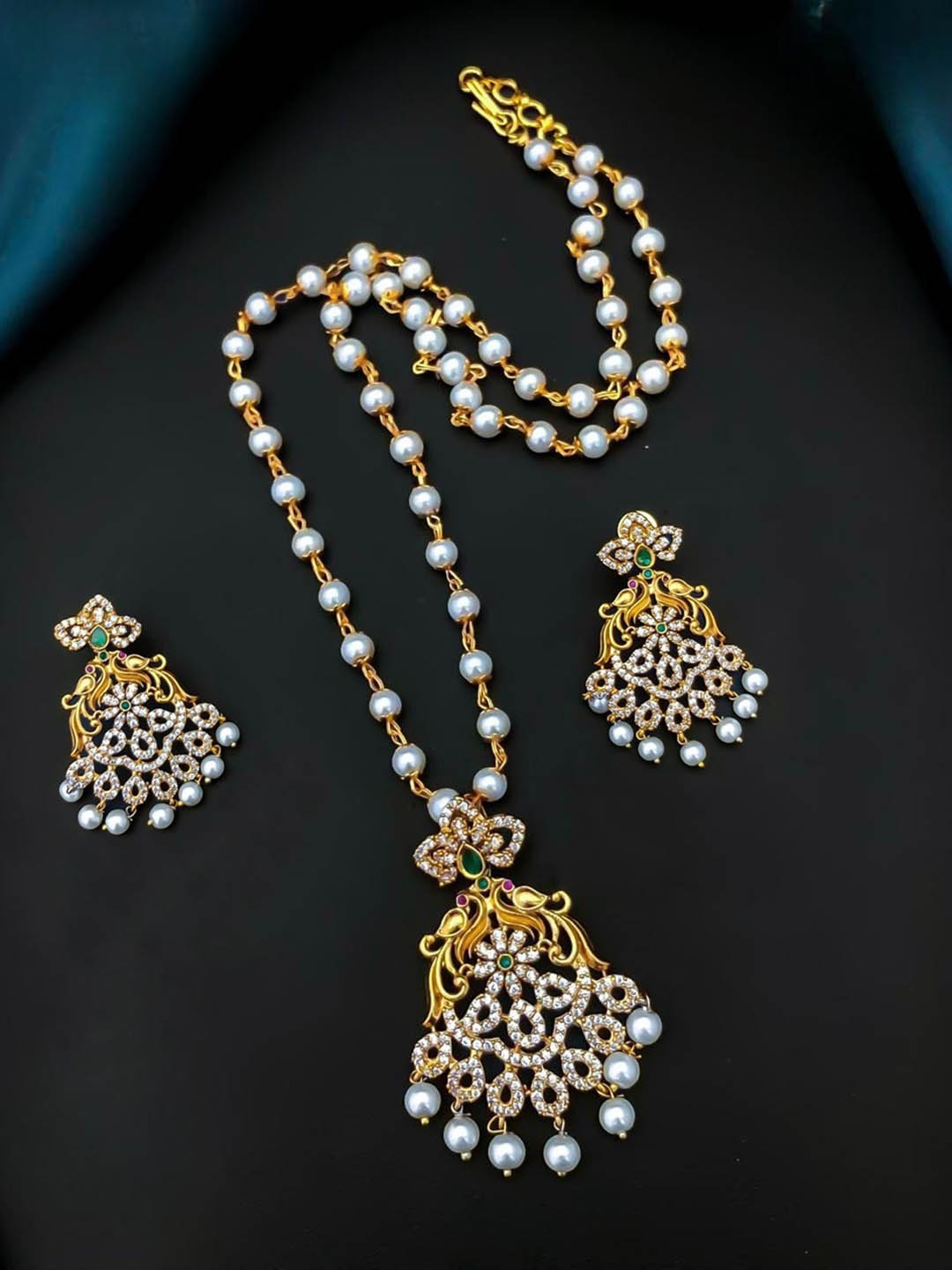 

Rangrozo Jewellery Gold Plated Cubic Zirconia Studded & Beaded Traditional Jewellery Set