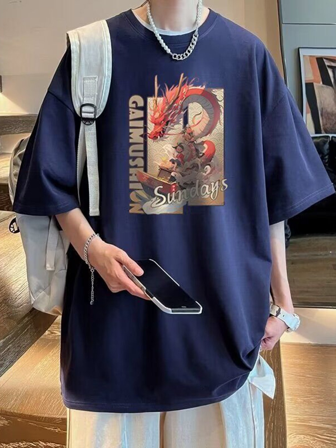 

HERE&NOW Men Graphic Printed Round Neck Cotton Oversized T-shirt, Blue