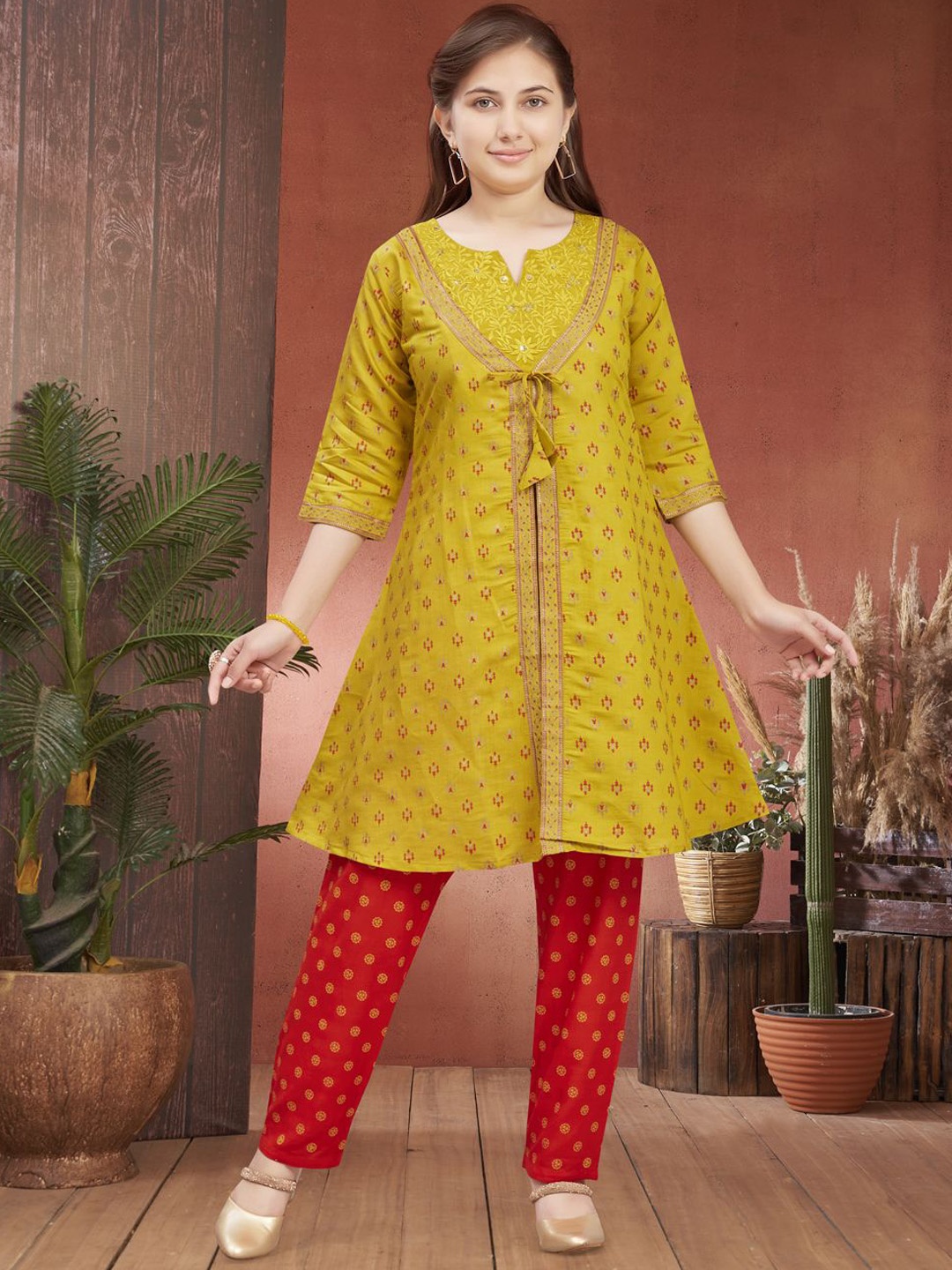 

Aarika Girls Ethnic Motifs Printed Notch Neck Sequinned Pure Silk Kurta With Trousers, Mustard