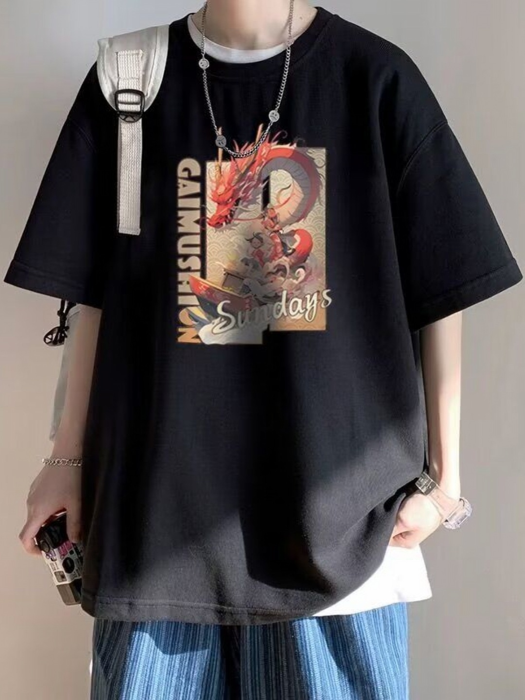 

HERE&NOW Men Graphic Printed Round Neck Cotton Oversized T-shirt, Black