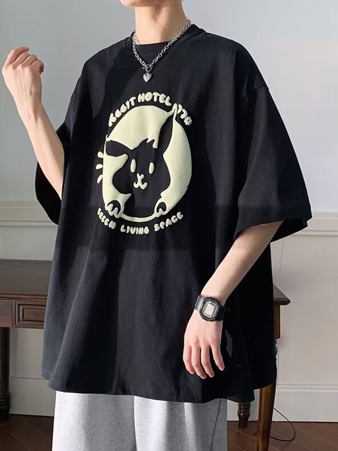 

HERE&NOW Men Graphic Printed Round Neck Cotton Oversized T-shirt, Black