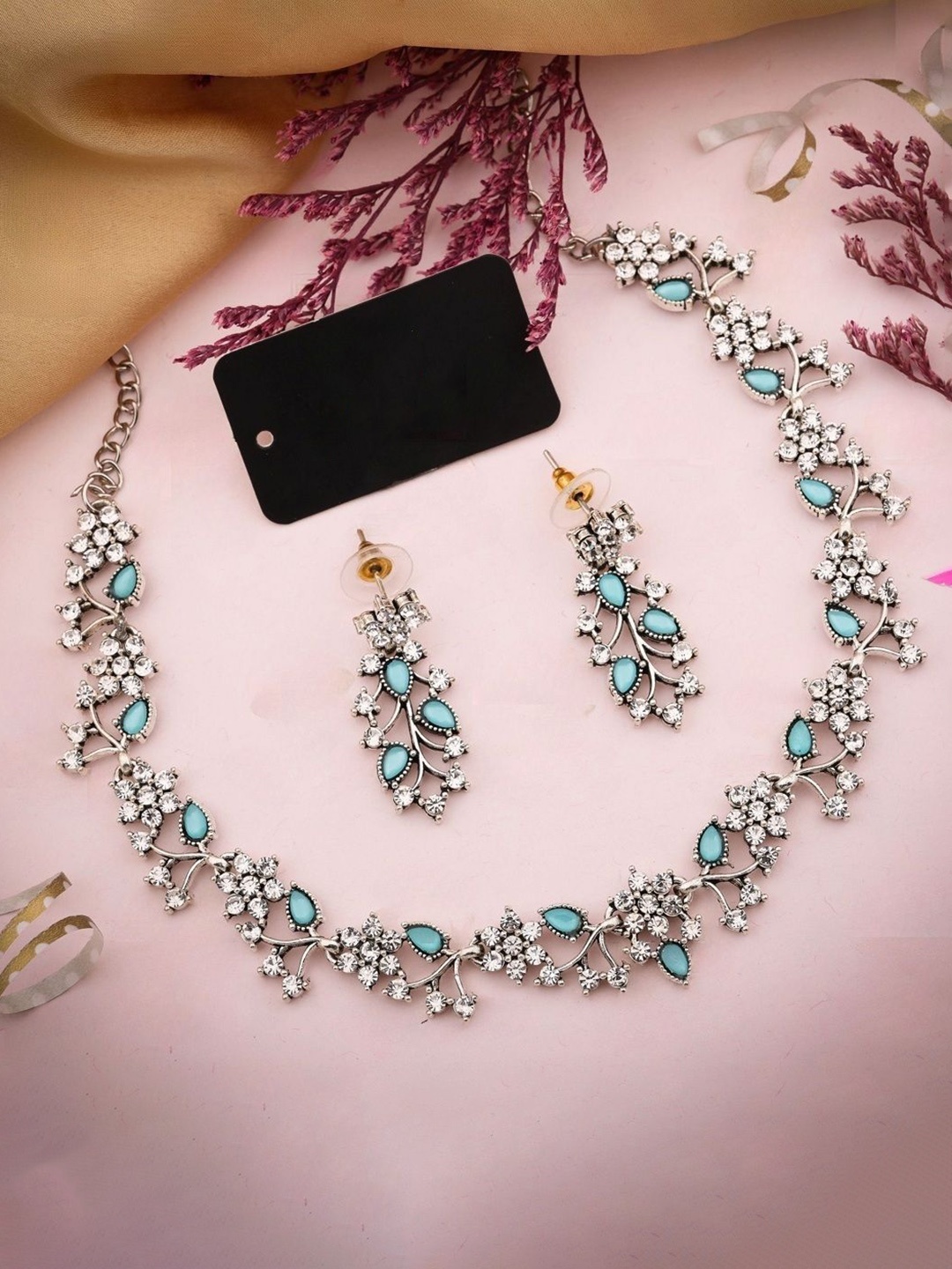 

Lyriss Silver-Plated American Diamond Studded Floral Shaped Jewellery Set