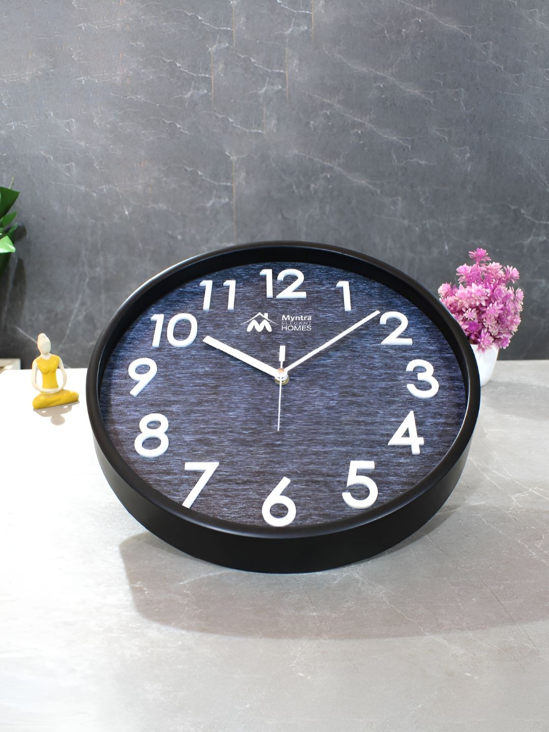 

Myntra Elegant Homes 12" Embossed Dial Wall Clock White & Blue Contemporary Wall Clock