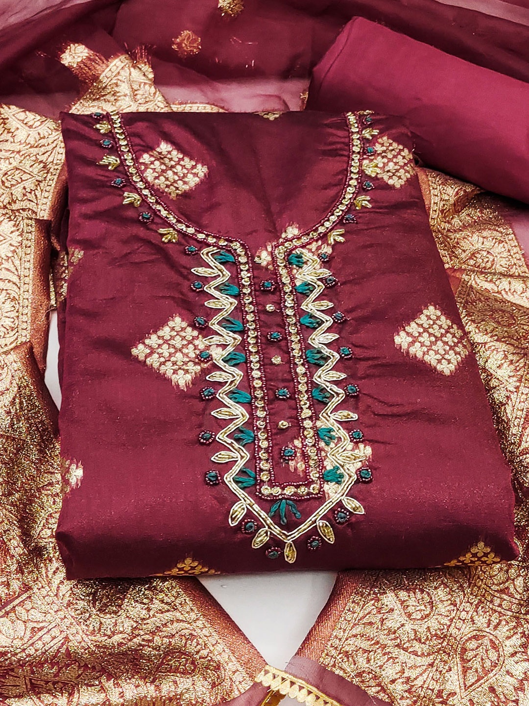 

SAINOOR Floral Embellished Beaded Semi-Stitched Banarasi Dress Material, Maroon