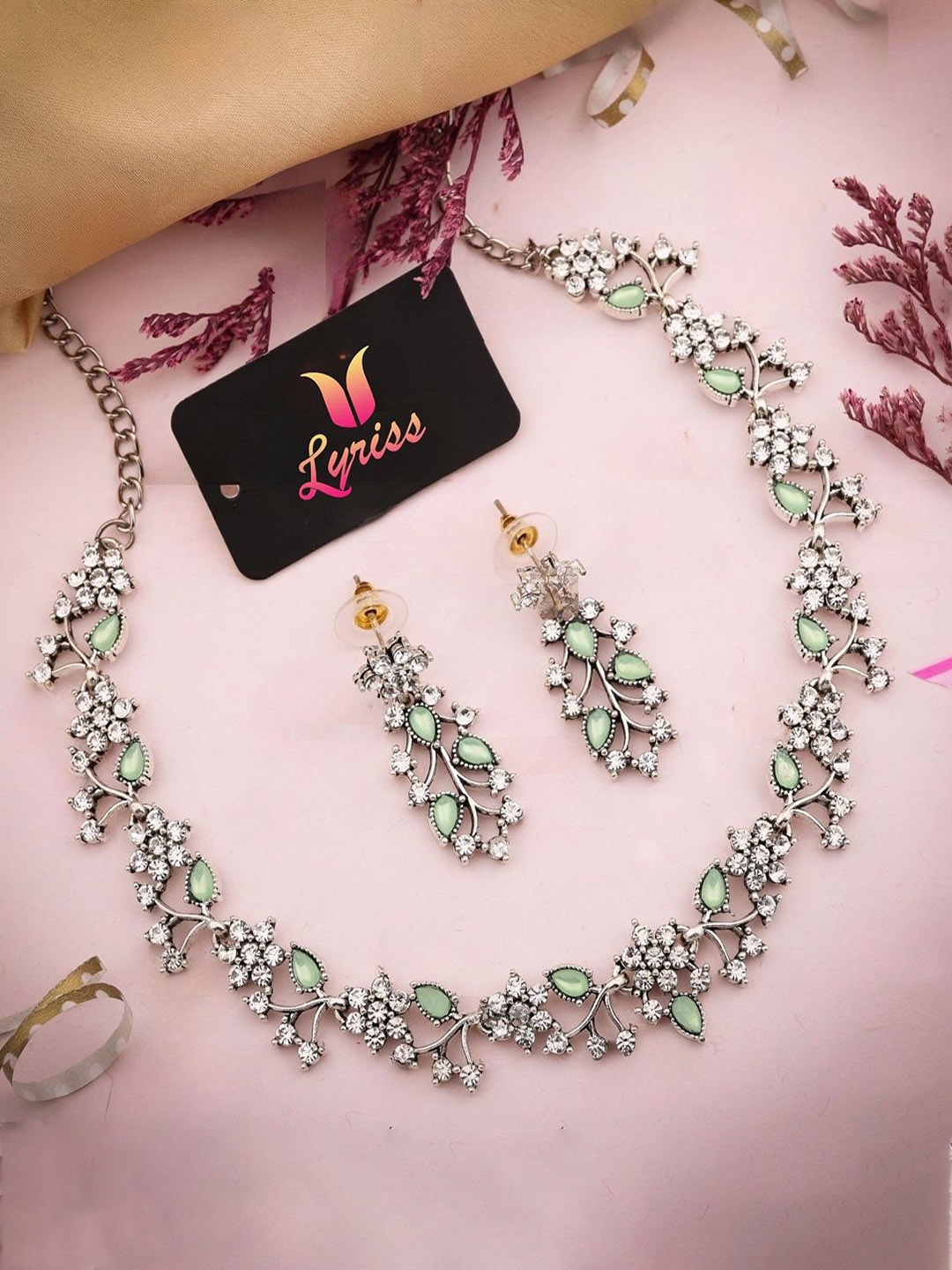 

Lyriss Silver-Plated American Diamond Studded Necklace And Earrings