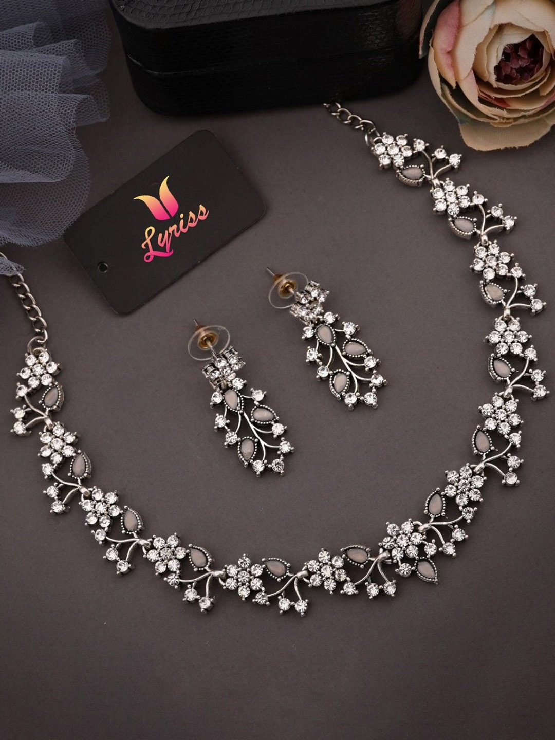 

Lyriss Silver-Plated Artificial Stones Studded Nacklace With Earrings
