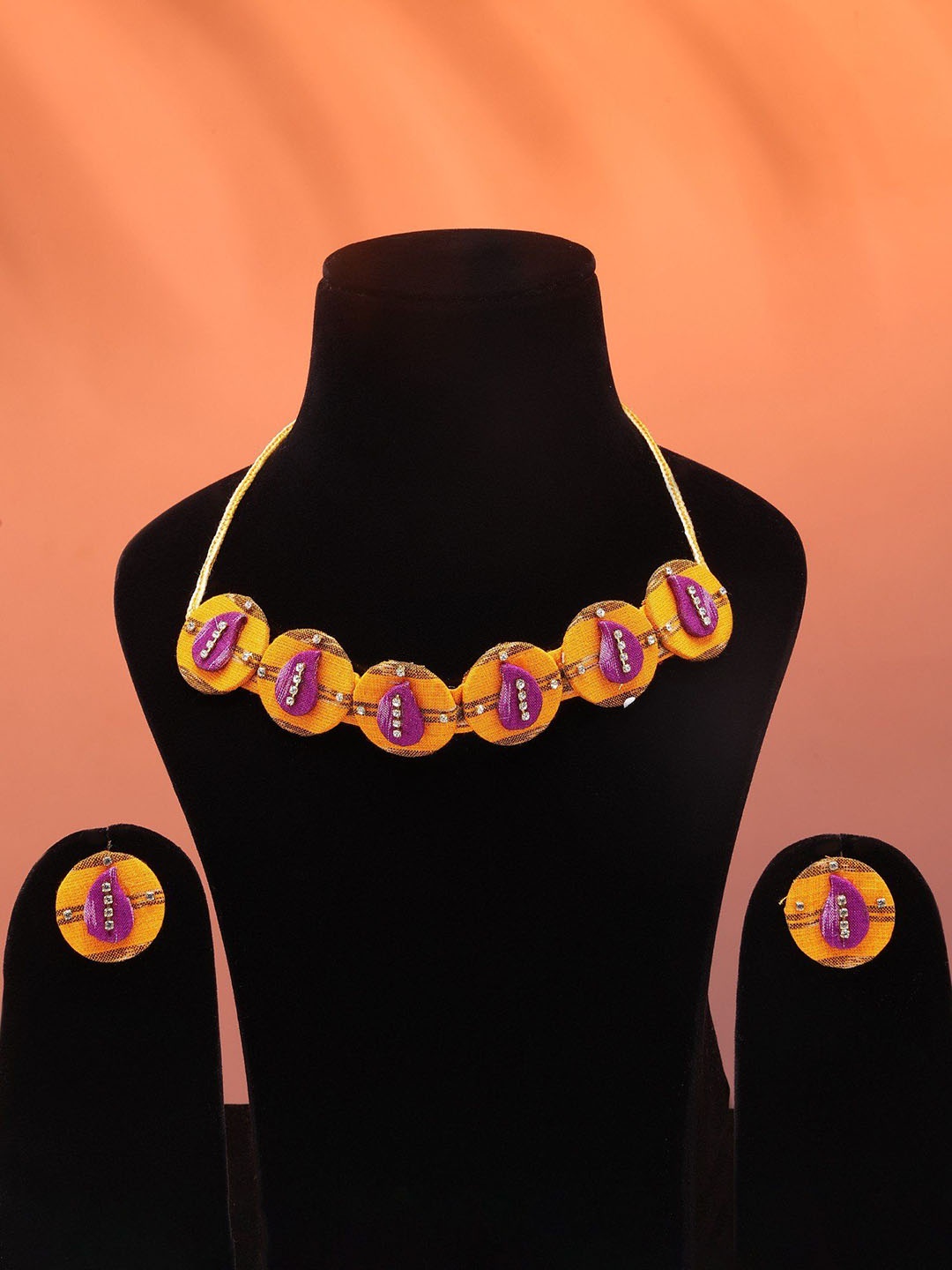 

Exotic India Round Shape Handloom Sambalpuri Fabric Choker Set with Earrings, Gold