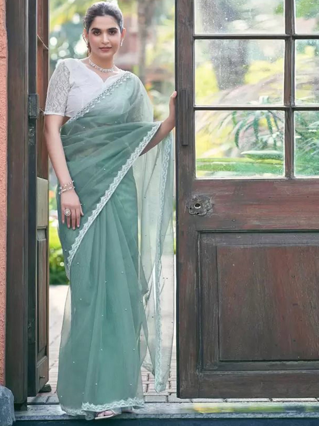 

VRAGI Embroidered Net Saree, Turquoise blue