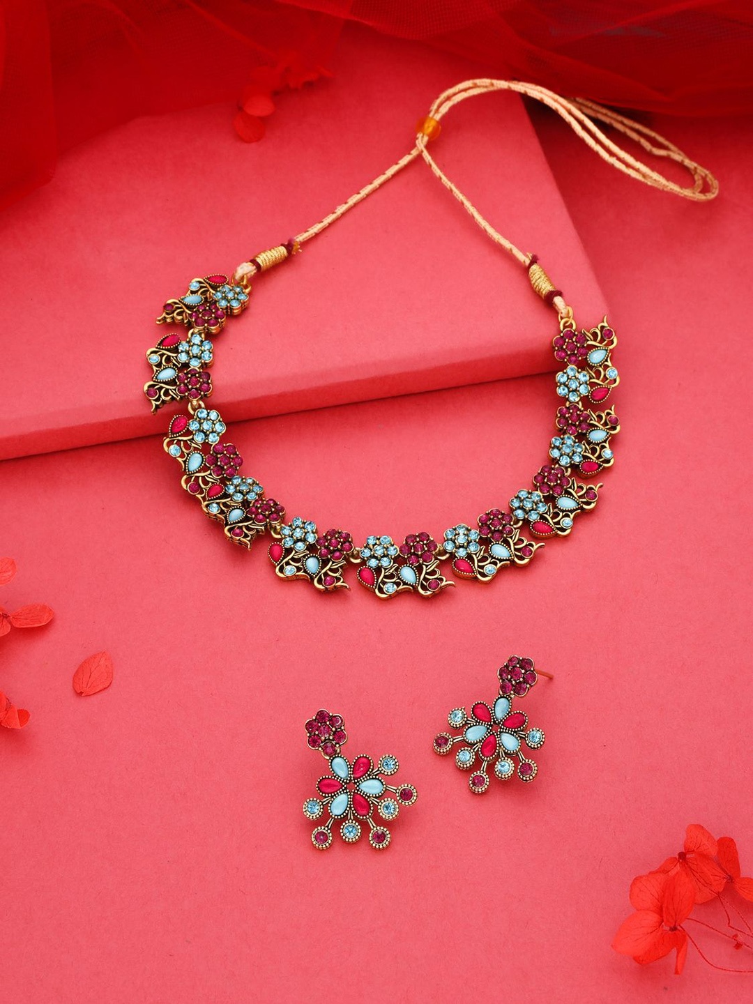 

Lyriss Gold-Plated American Diamond Studded Necklaces And Earrings