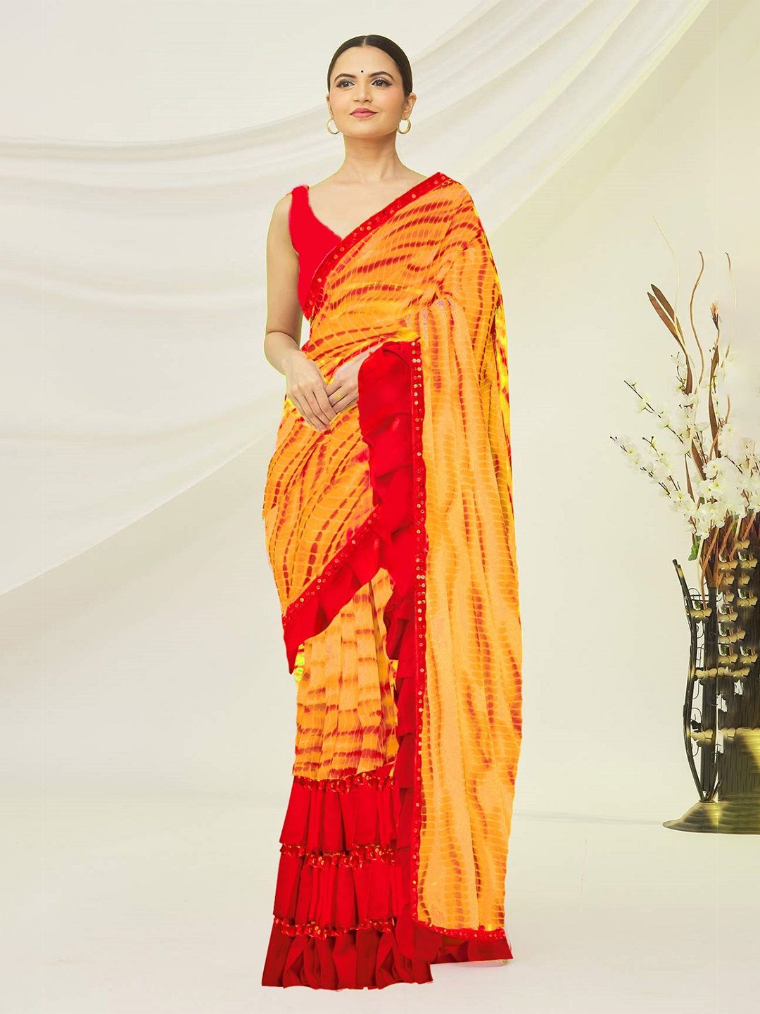 

Moda Rapido Sequinned Ruffles Pure Georgette Leheriya Saree, Yellow