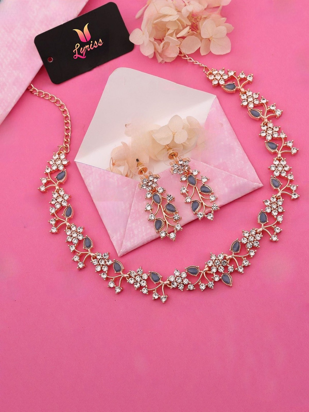

Lyriss Batali Gold-Plated American Diamond Studded Floral Shaped Jewellery Set