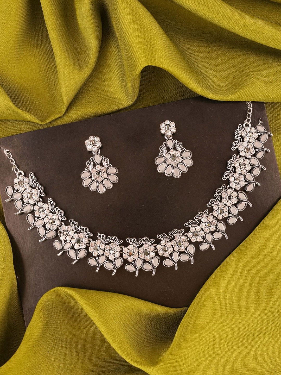 

Lyriss Silver-Plated Artificial Stones Studded Jewellery Set