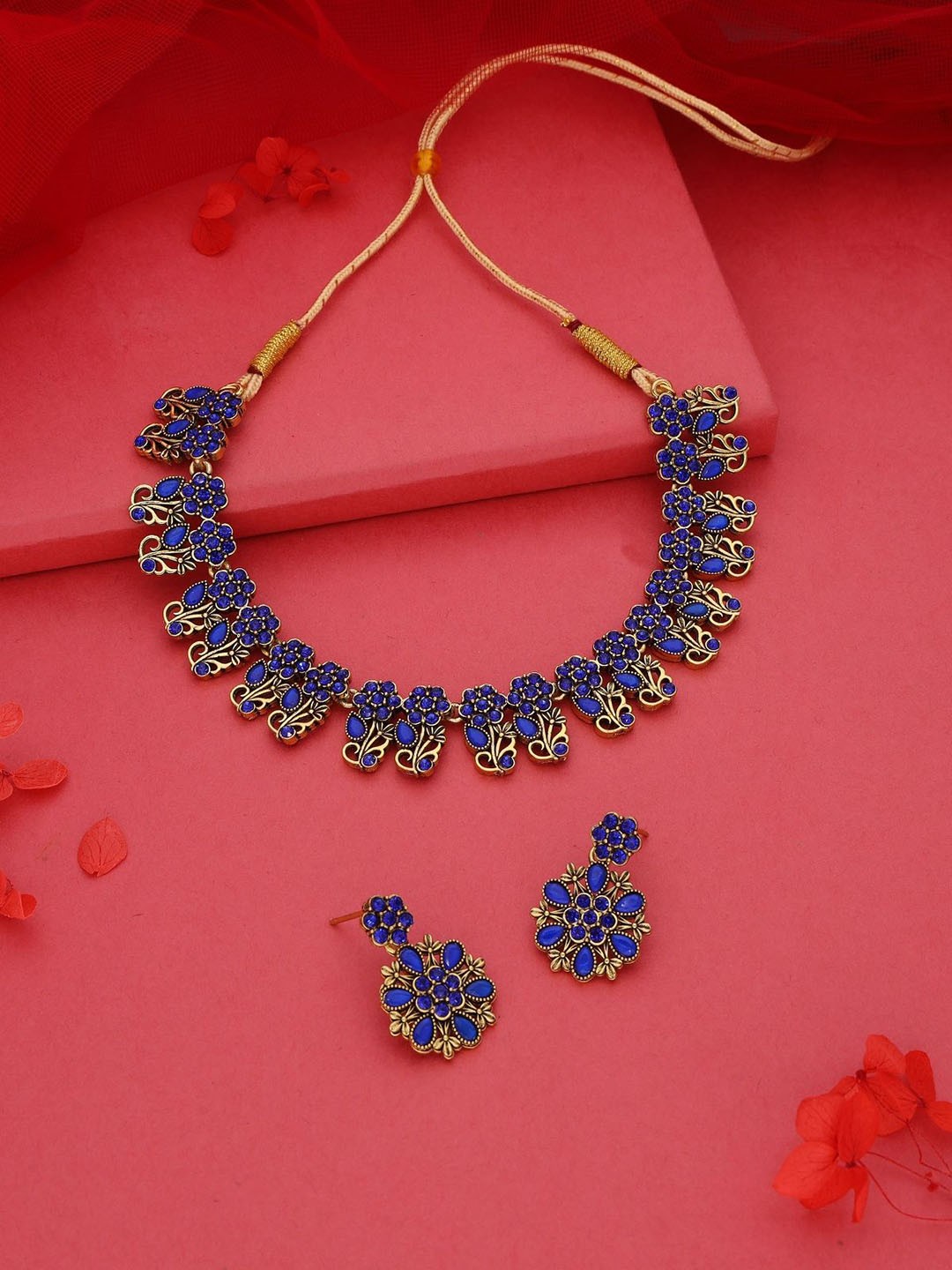 

Lyriss Gold-Plated American Diamond Studded Necklaces And Earrings