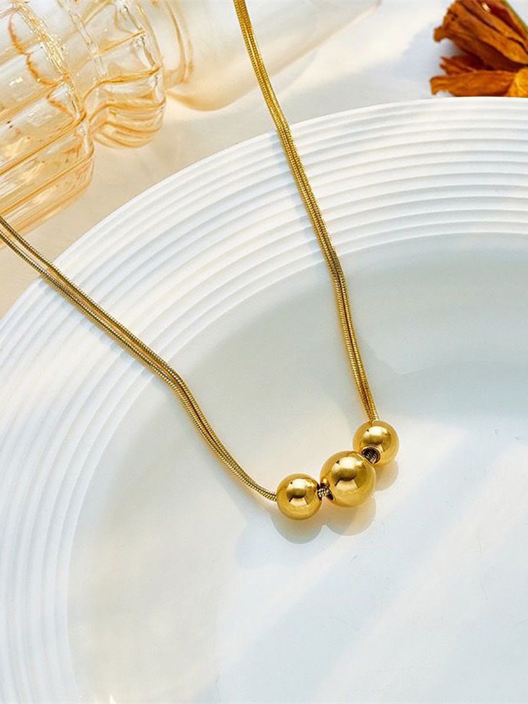

DressBerry Gold-Plated Circular Shaped Pendant With Chain