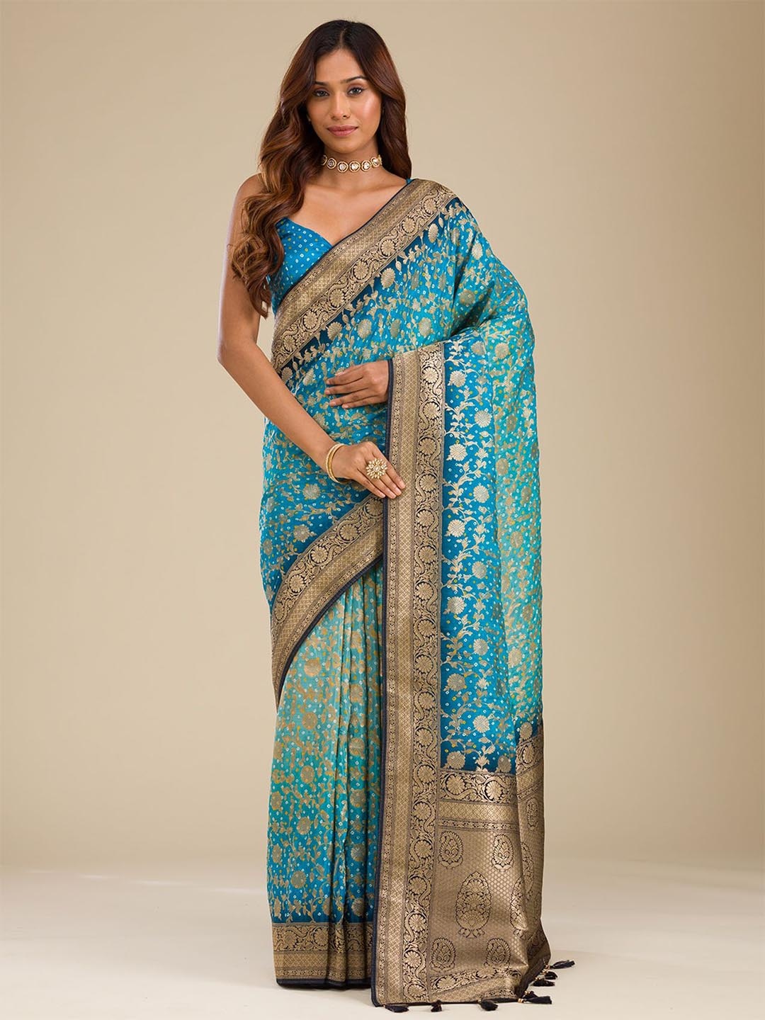 

Koskii Turquoise Blue Zariwork Georgette Saree