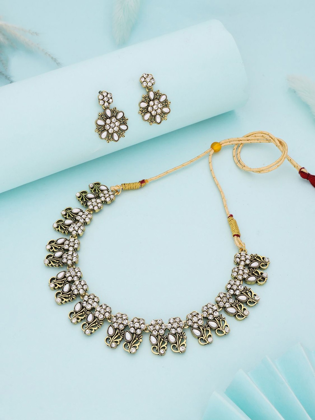 

Lyriss Gold-Plated American Diamond Studded Necklace And Earrings