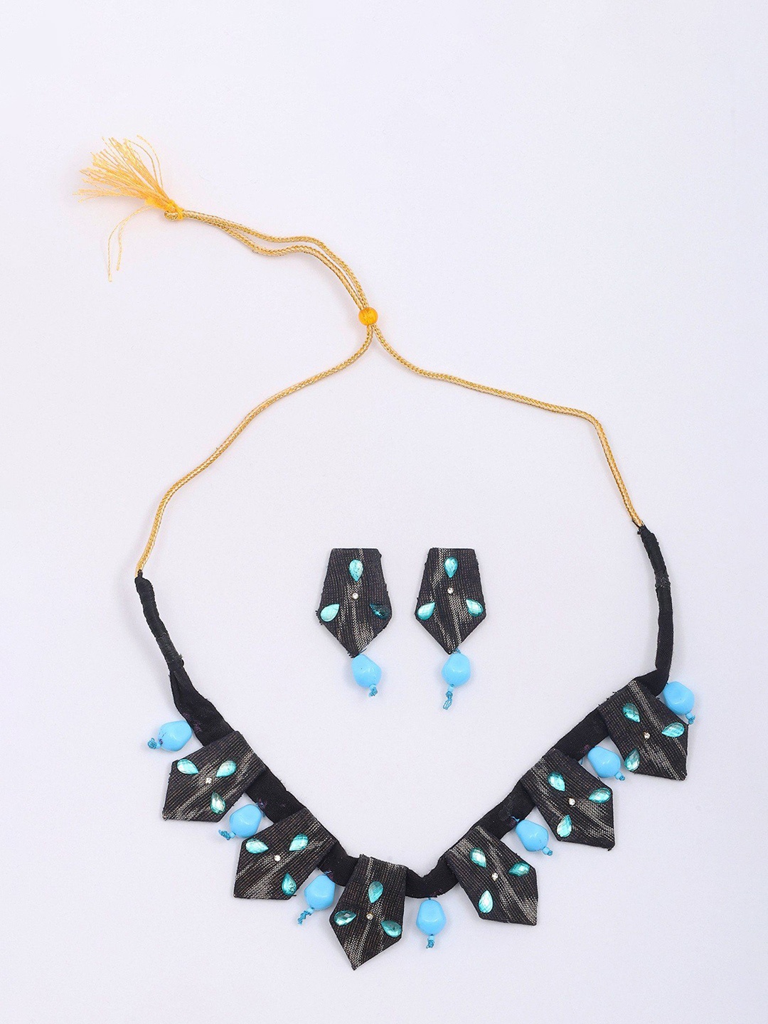 

Exotic India Handloom Sambalpuri Fabric Necklace-Earrings Set with Dangling Tumbled Stone, Gold