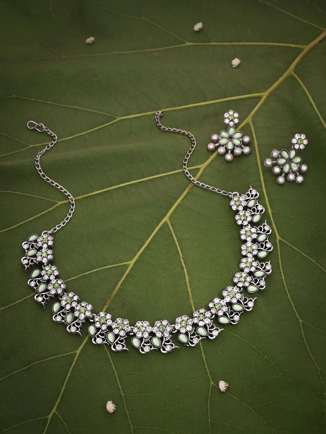 

Lyriss Silver-Plated Artificial Stones Studded Necklaces And Earrings