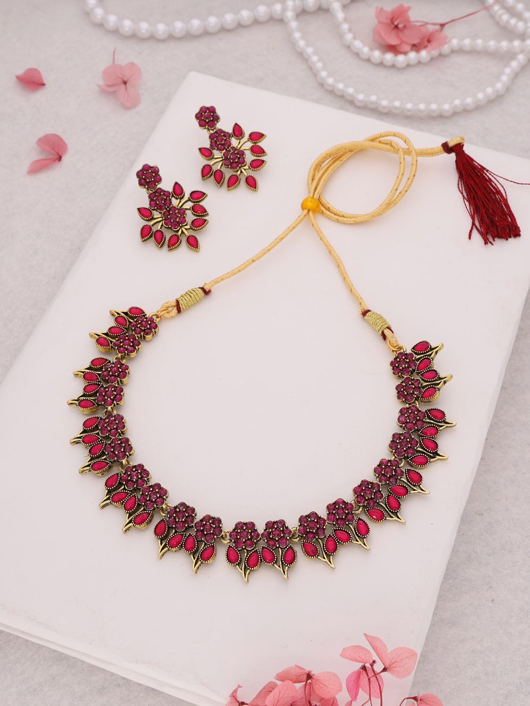 

Lyriss Gold-Plated American Diamond Studded Necklaces And Earrings