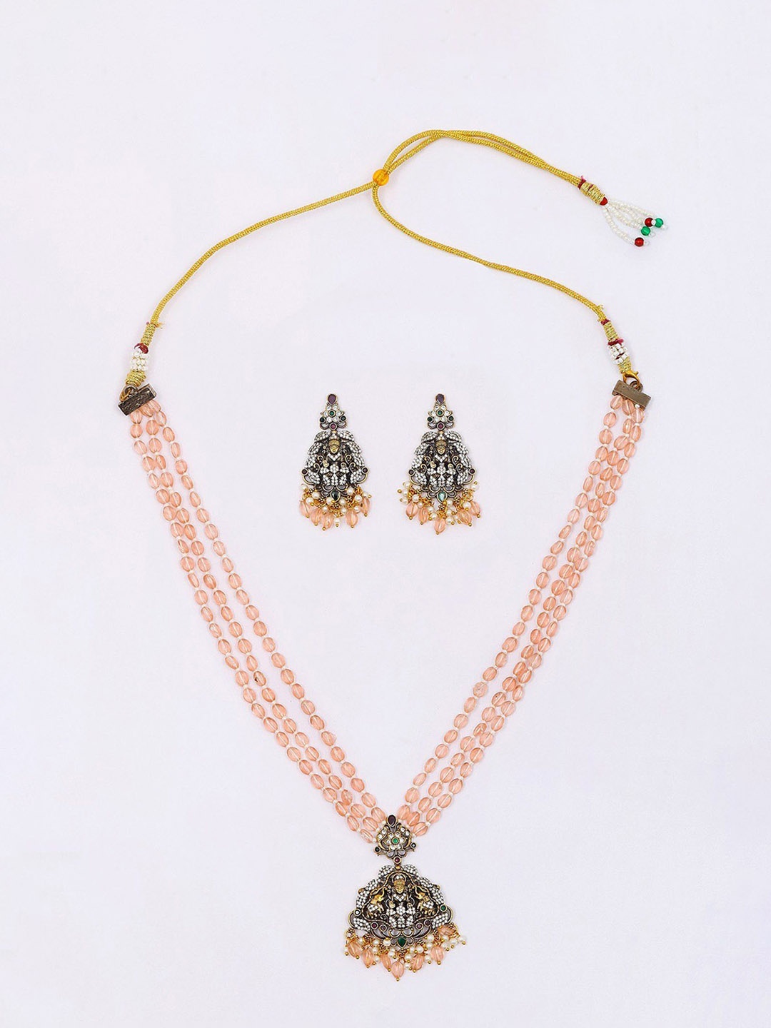 

Exotic India Stone Studded Goddess Gajalakshmi Necklace with Earrings Set & Beaded Strand, Gold