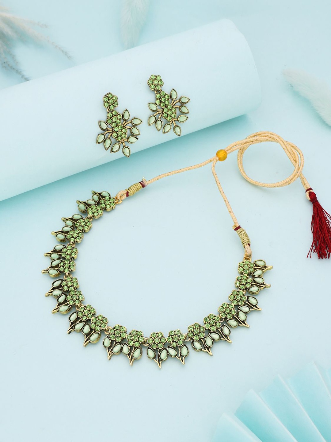 

Lyriss Gold-Plated American Diamond Studded Necklaces And Earrings