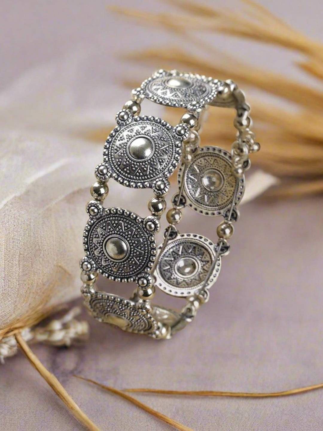 

Sangria Silver Plated Oxidised Floral Design Tribal Bracelet