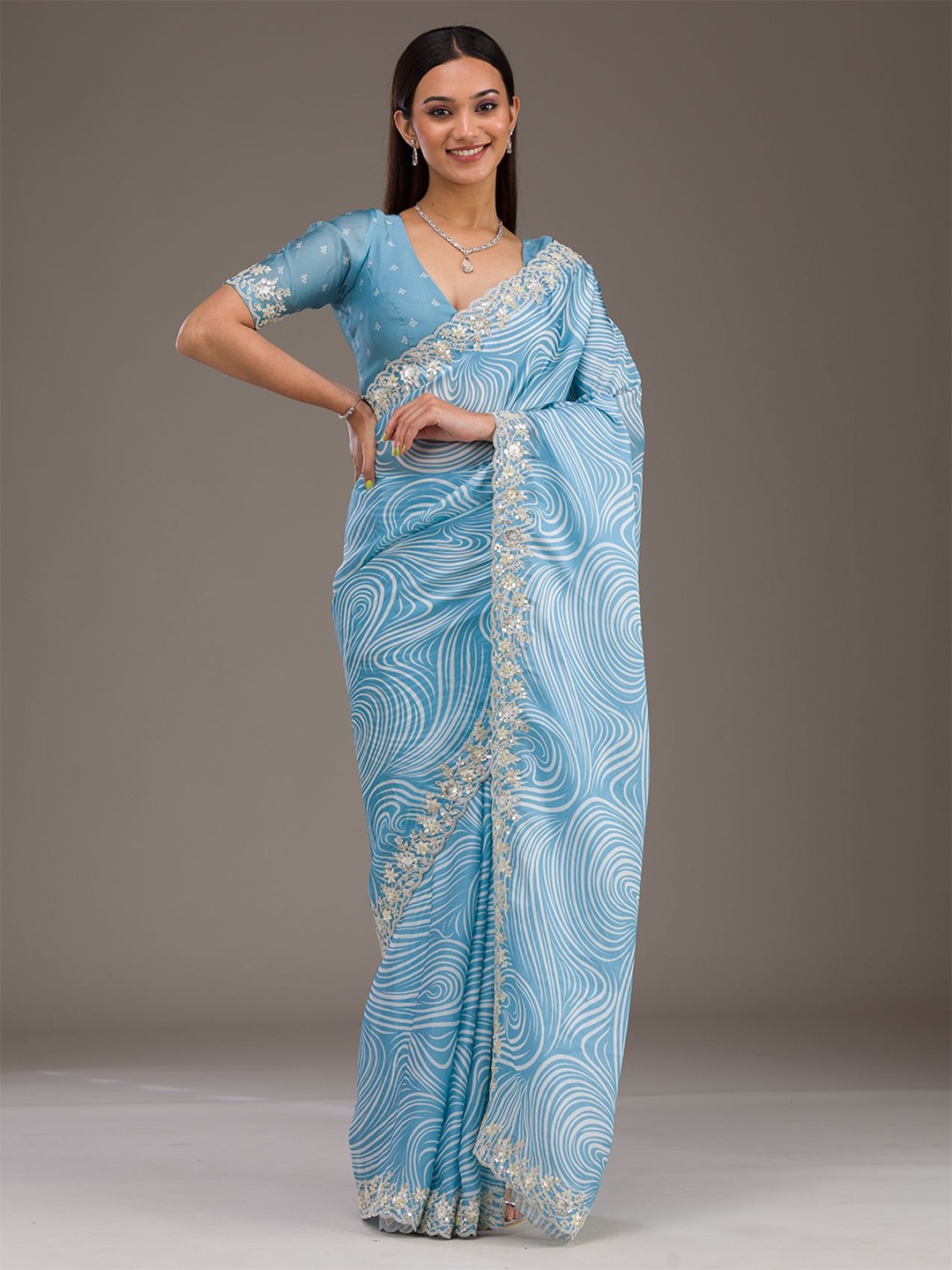

Koskii Sky Blue Zariwork Georgette Saree