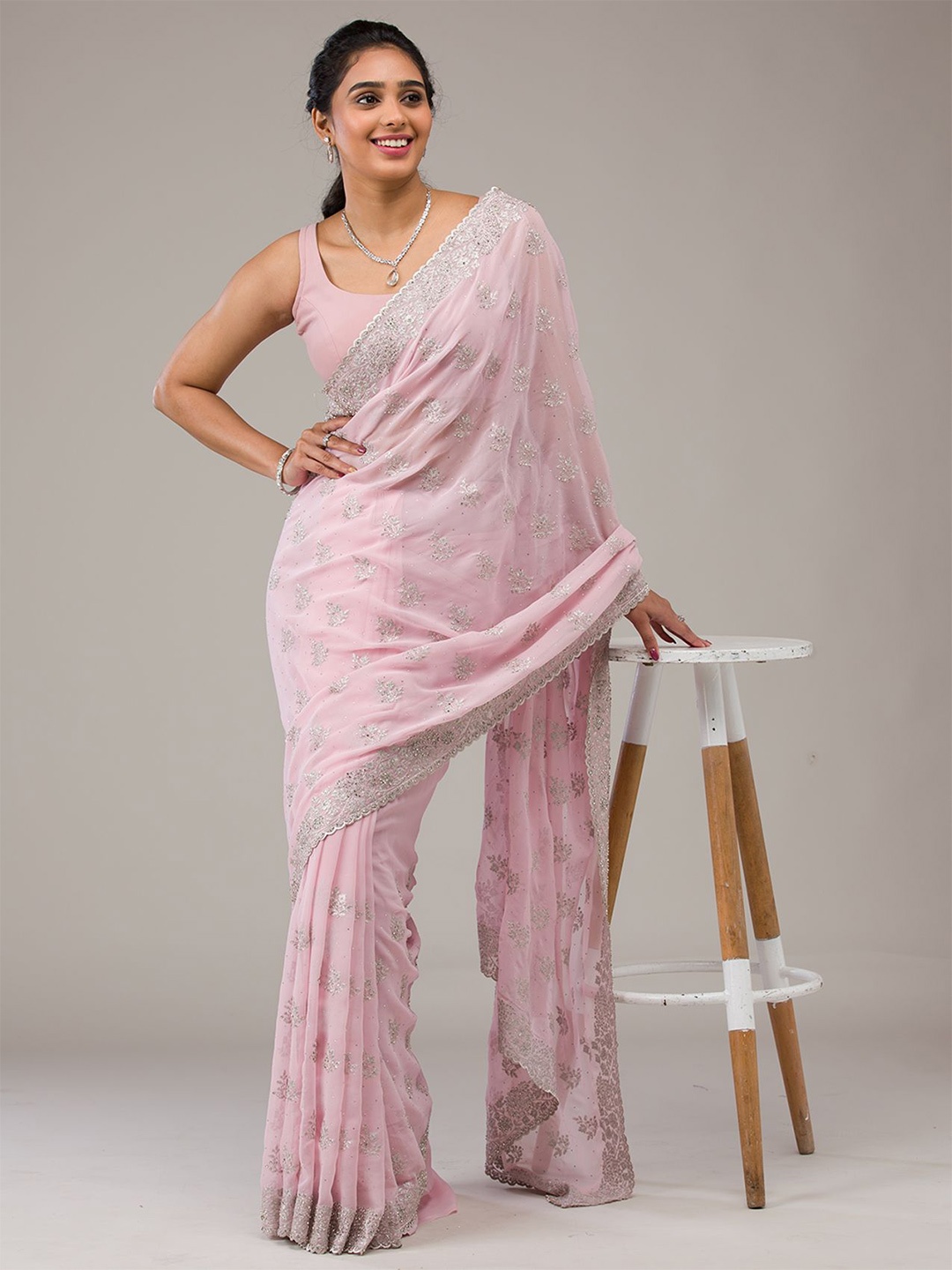 

Koskii Embellished Baby Pink Silver Stonework Georgette Saree