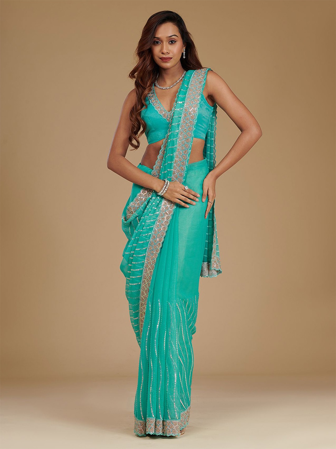 

Koskii Turquoise Blue Stonework Chiffon Saree