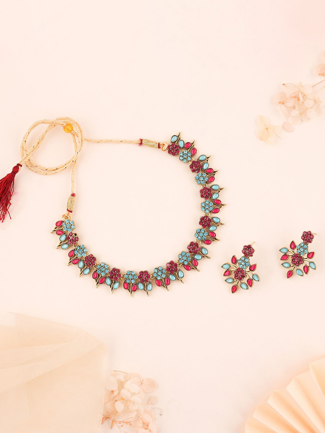 

Lyriss Gold-Plated American Diamond Studded Necklaces And Earrings