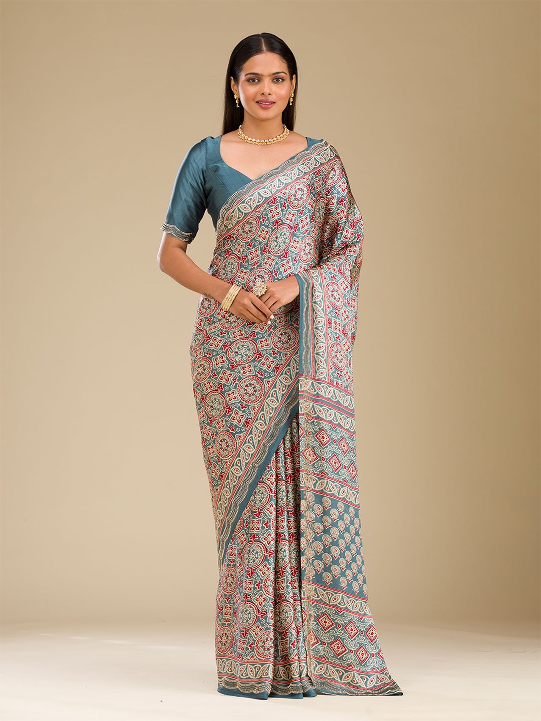

Koskii Blue Printed Satin Saree