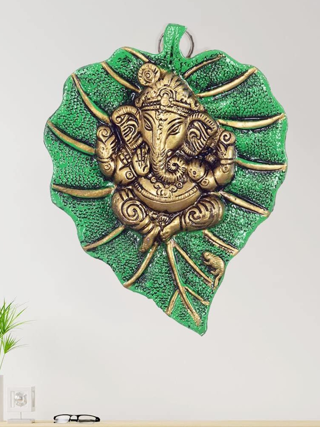 

CRAFTAM Green and Gold-Toned Lord Ganesha on Leaf Metal Religious Idol Showpiece
