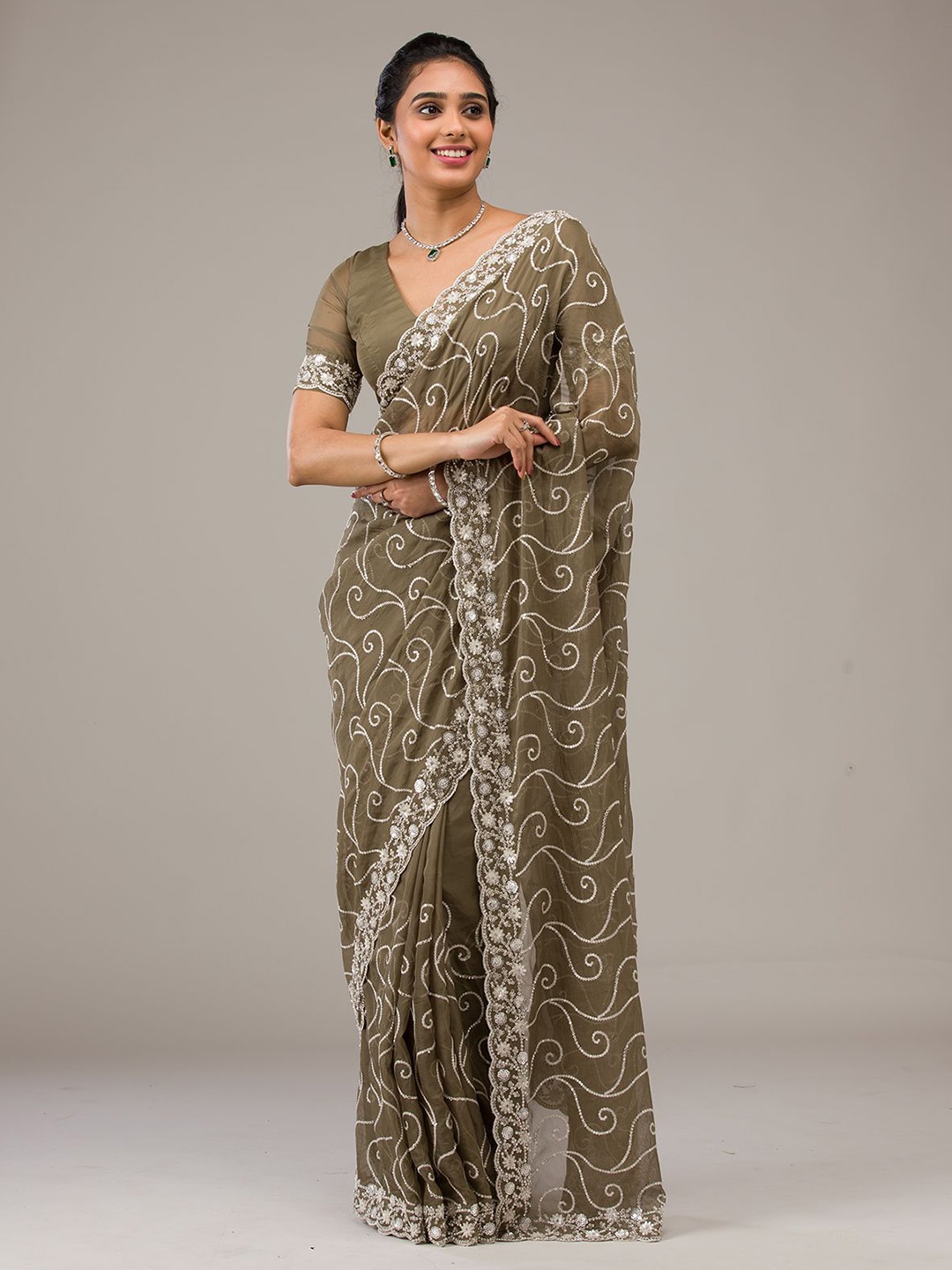 

Koskii Rust Sequins Georgette Saree