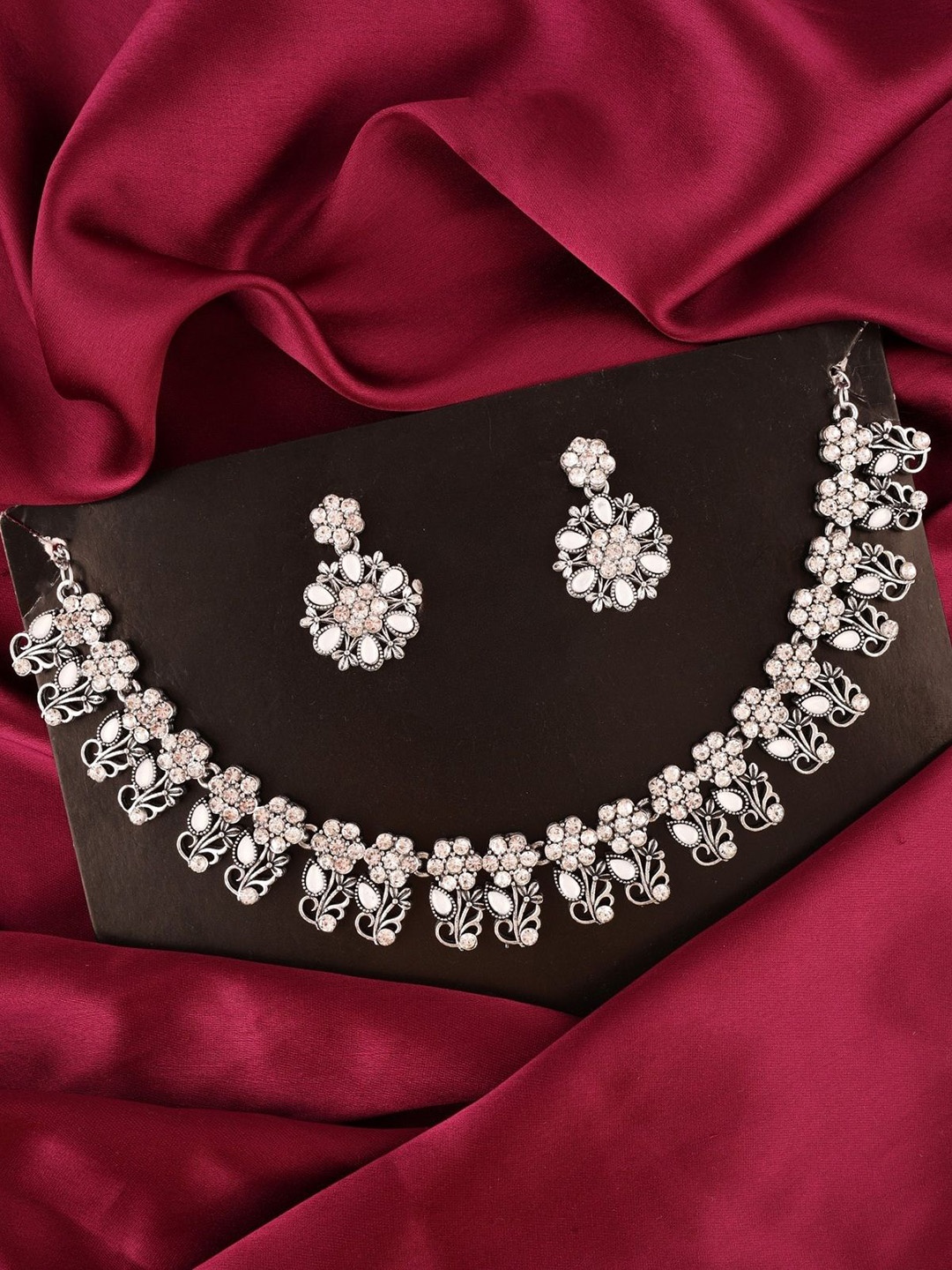 

Lyriss Silver-Plated American Diamond Studded Necklace and Earrings