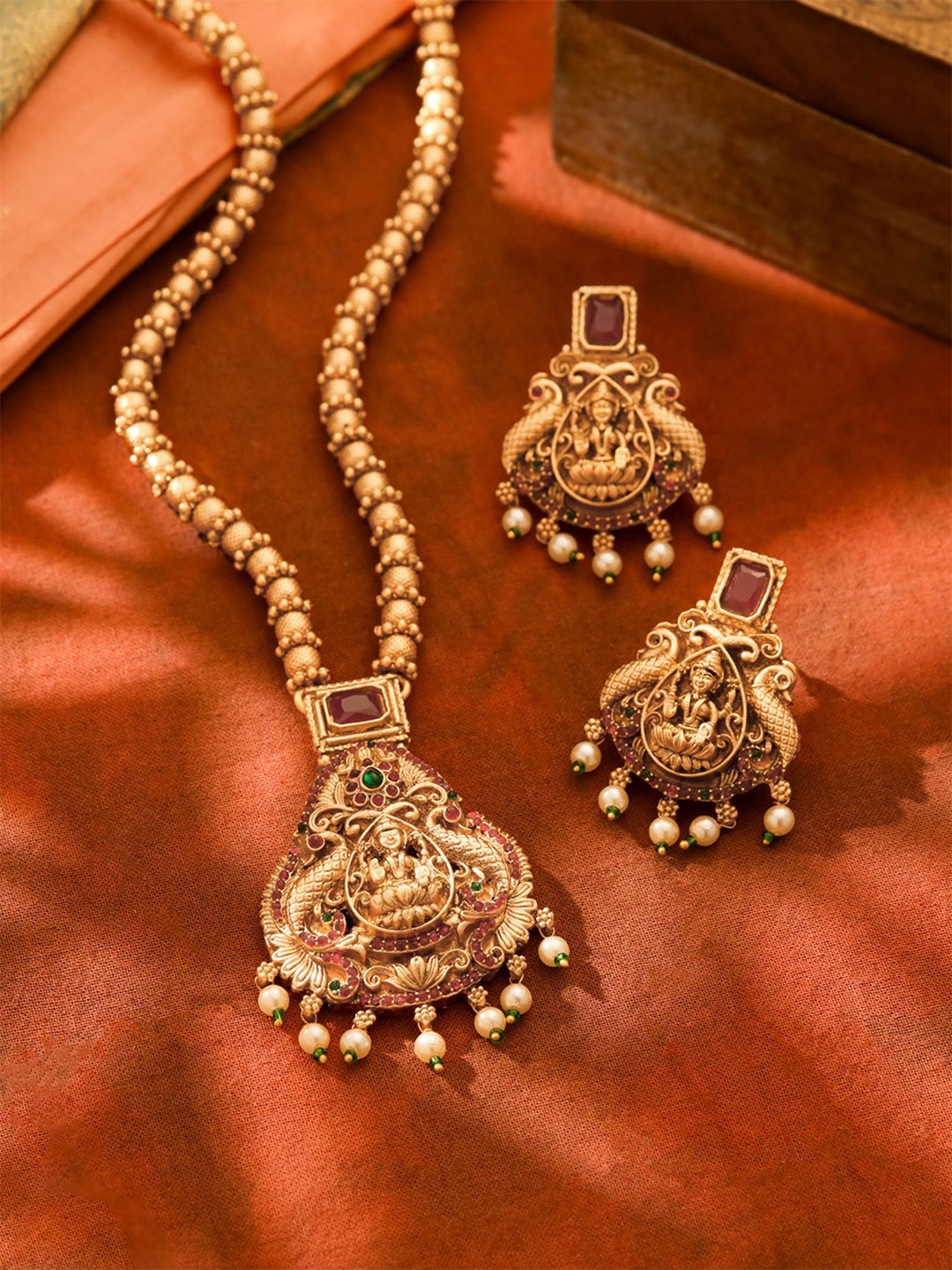 

Yellow Chimes Gold-Plated Stone-Studded & Beaded Lakshmi Goddess Jewellery Set