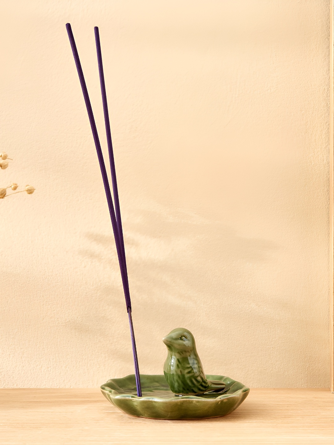 

Home Centre Garnet Serene Green Ceramic Bird Incense Holder