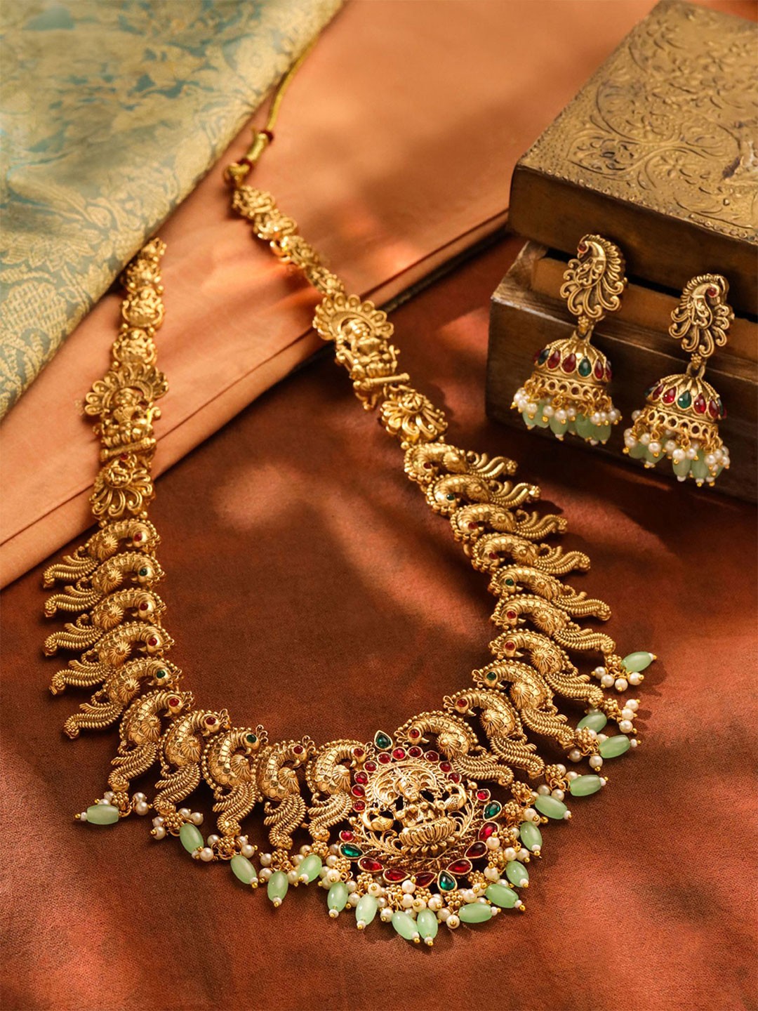 

Yellow Chimes Gold-Plated Stone-Studded & Beaded Lakshmi Goddess Jewellery Set